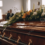 pngtree-funeral-service-at-a-funeral-home-with-caskets-in-the-background-picture-image_3145060